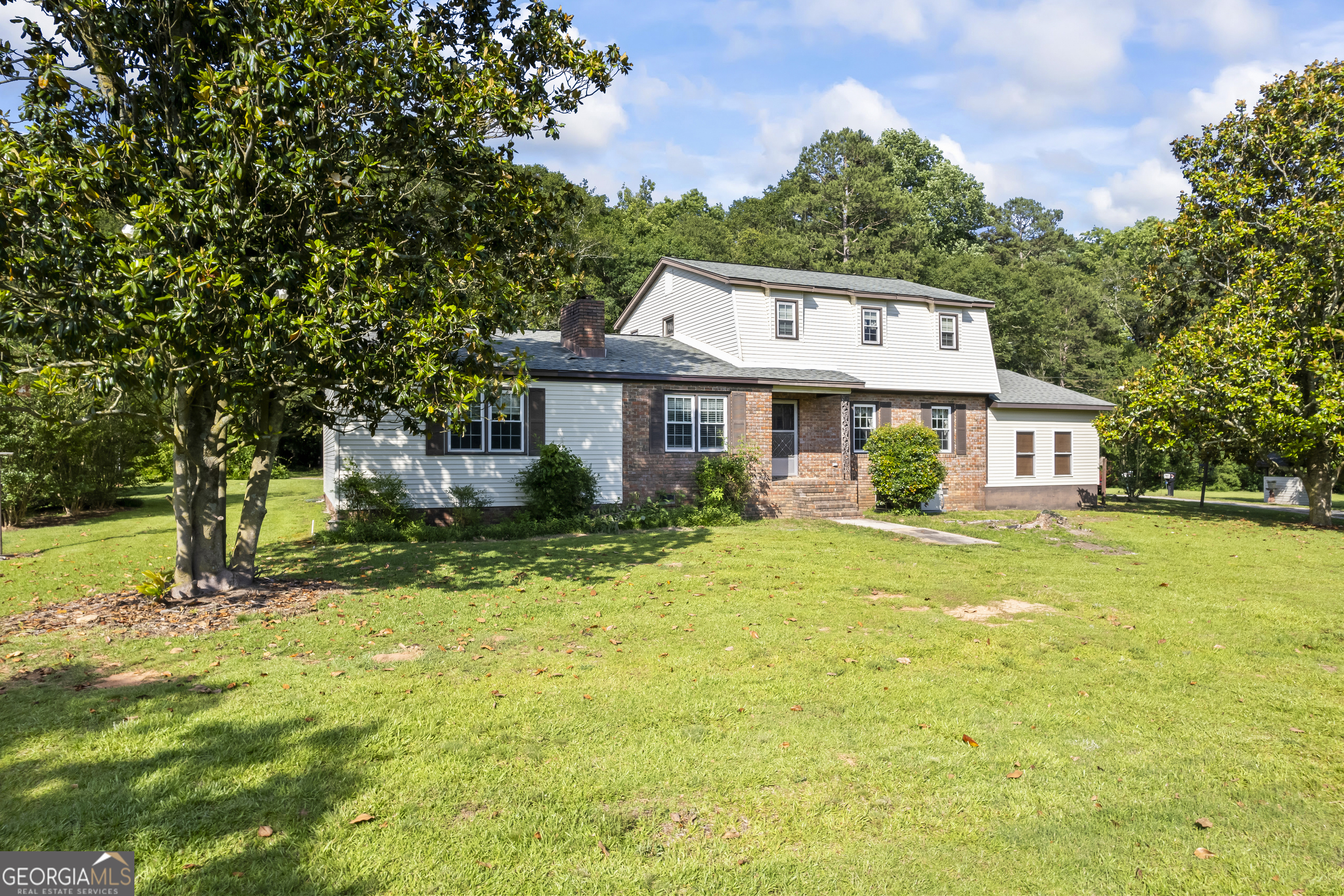 a front view of a house with a yard