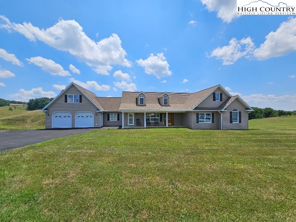 a view of a house with a big yard