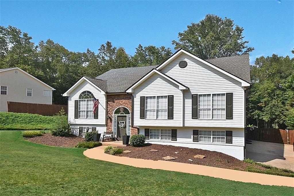 a front view of a house with a yard