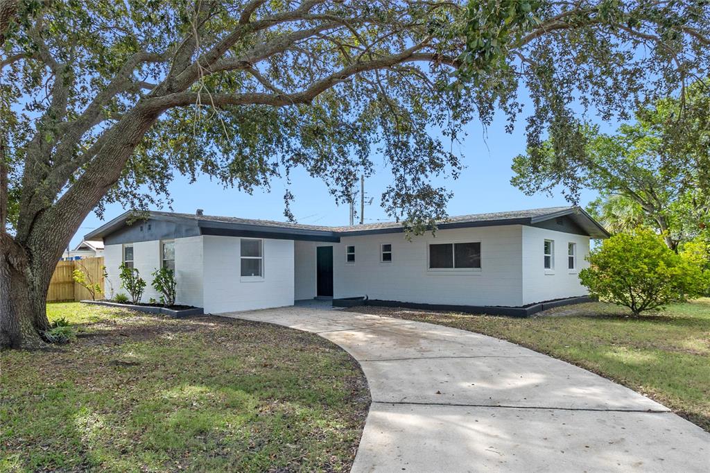 a house with trees in the background