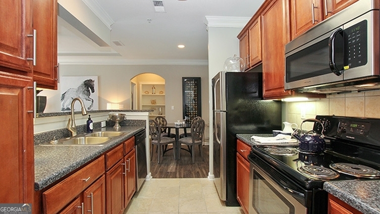 a kitchen with a stove and a sink