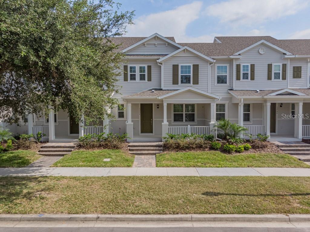 a front view of a house with a yard