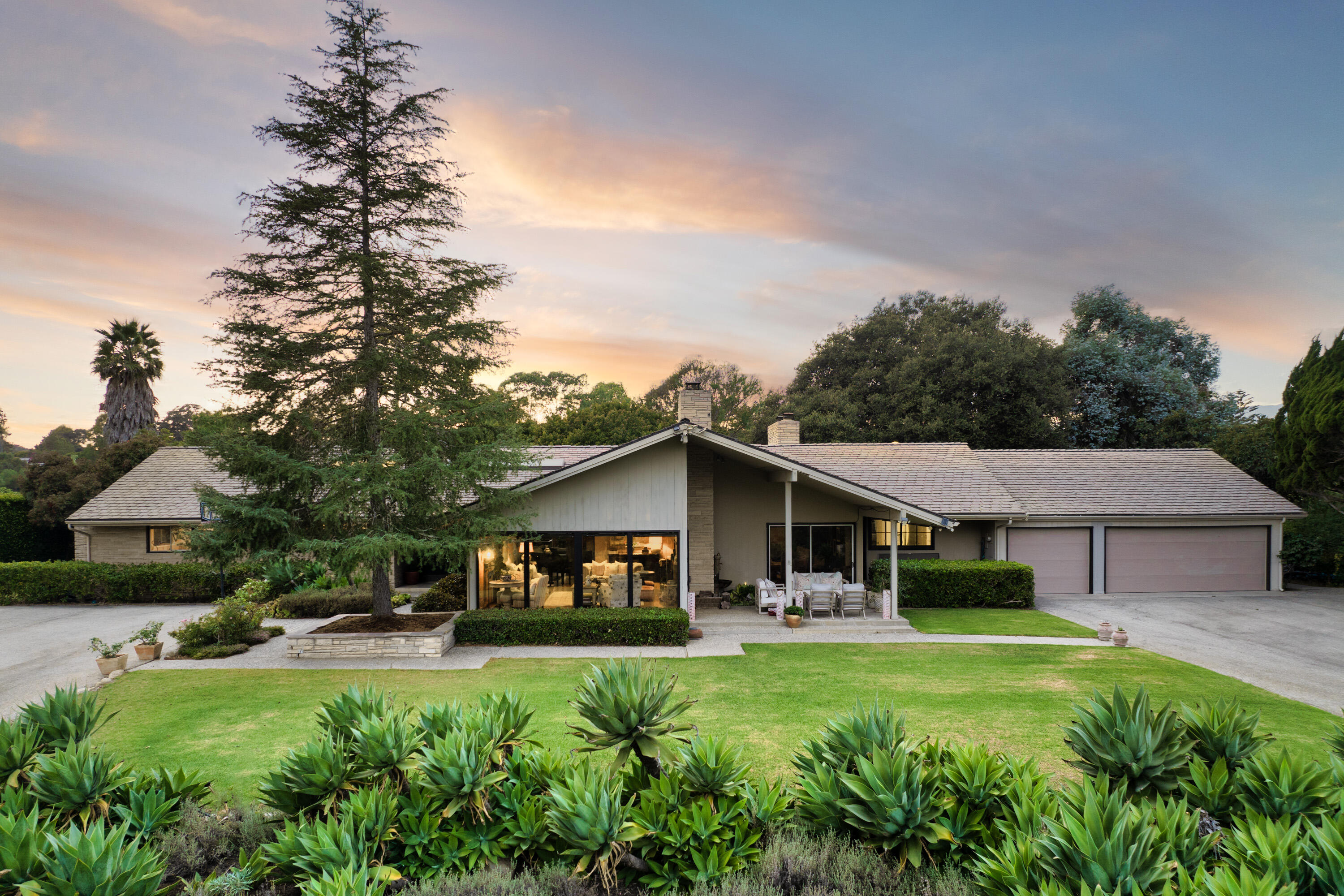 a front view of a house with garden