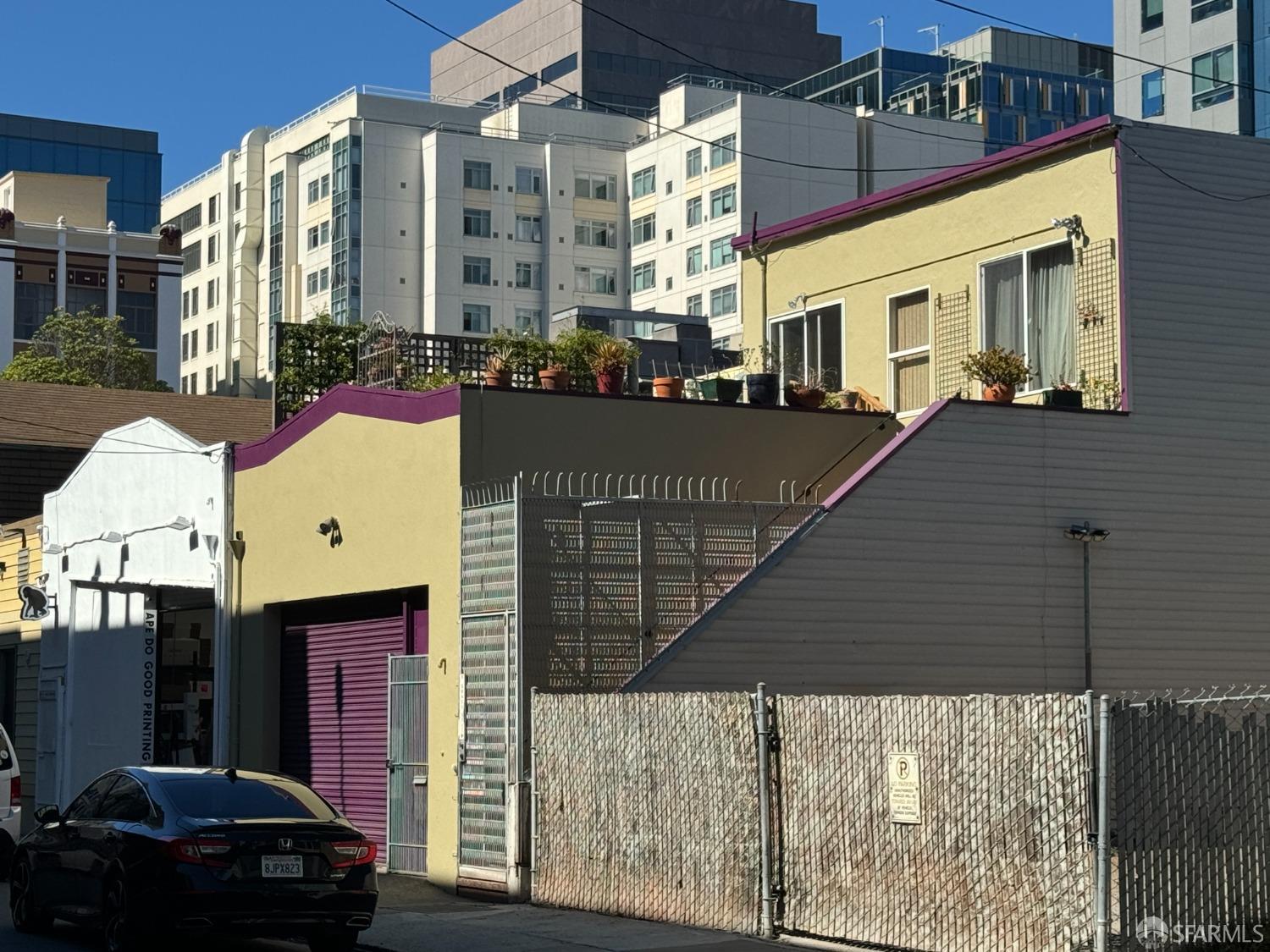 a front view of a building with parking space