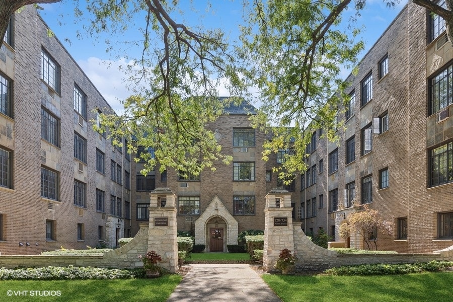 a front view of a building with garden