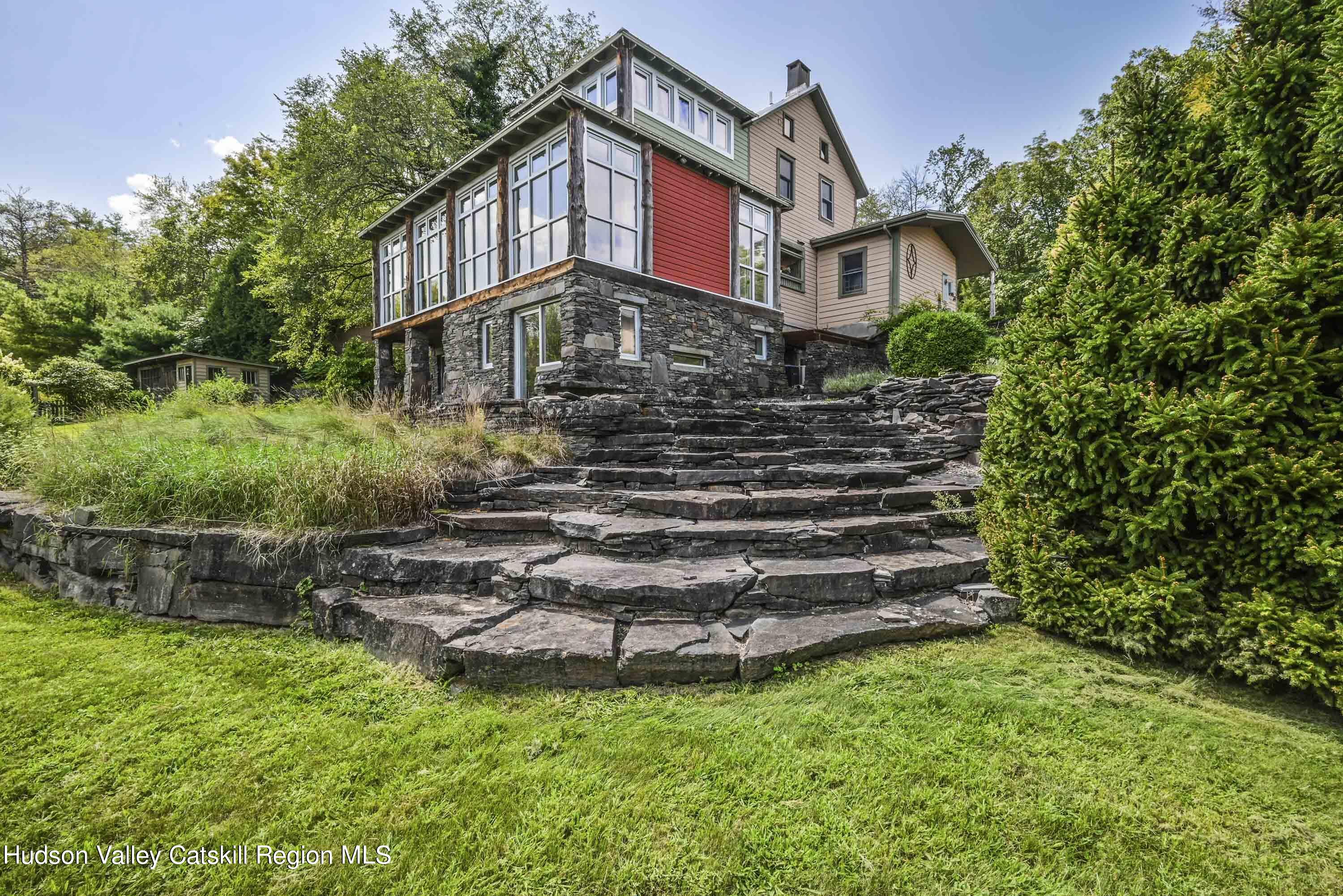 a view of a house with a yard