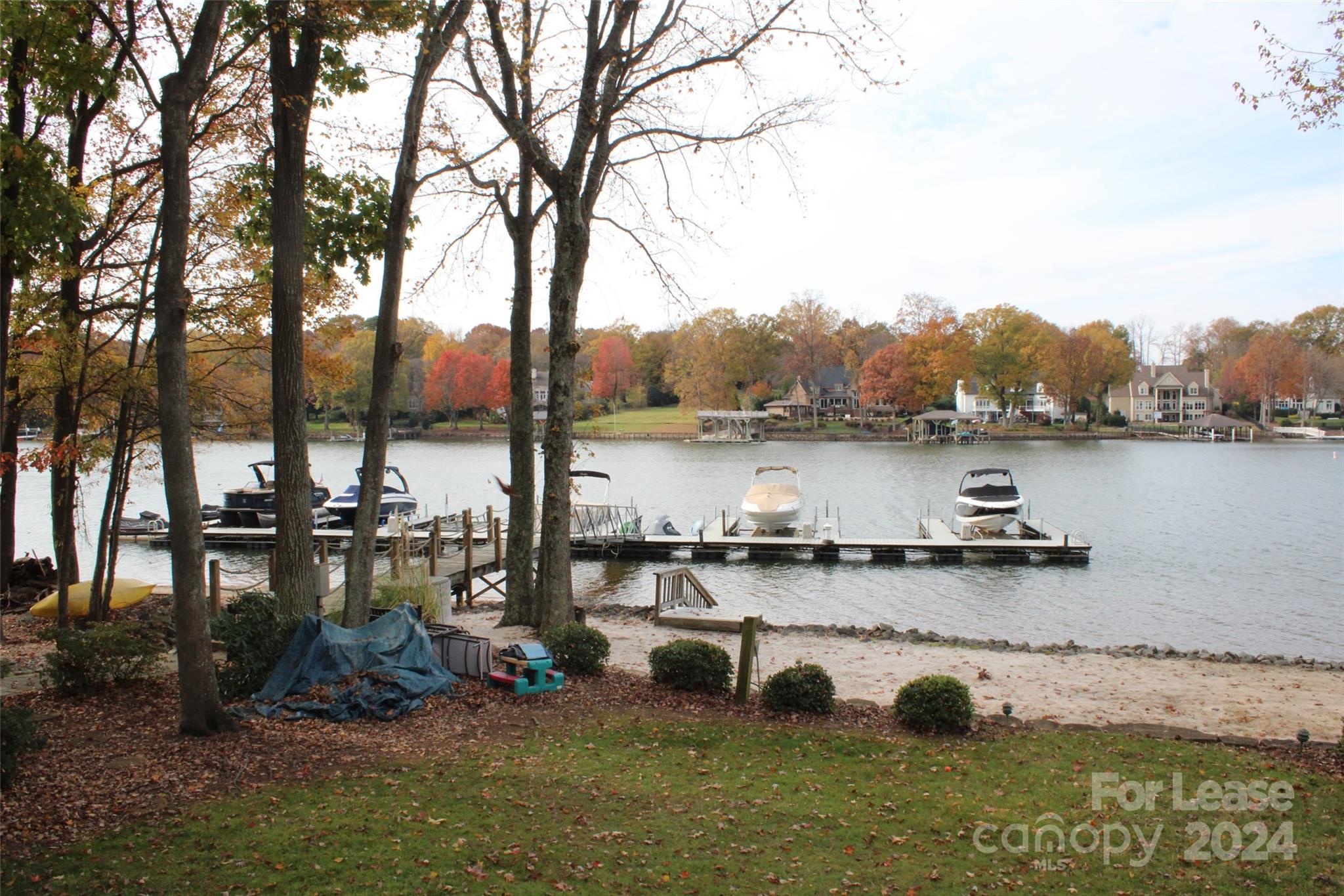 a view of outdoor space with seating area and lake view