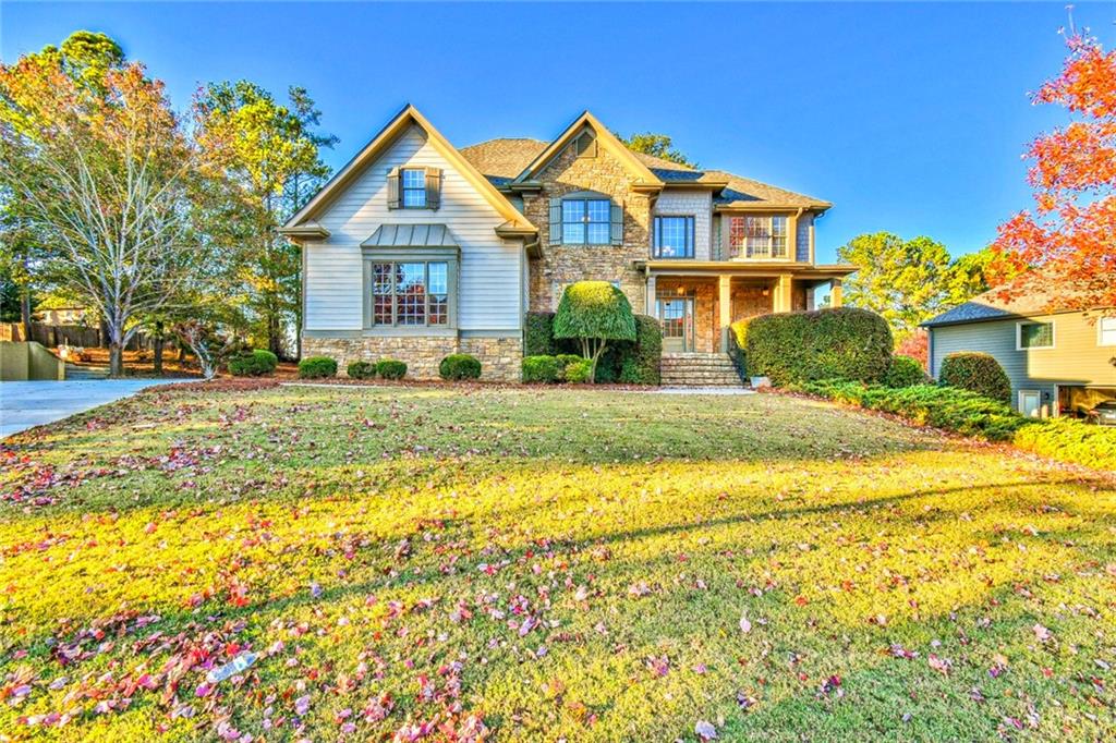 a front view of a house with a yard