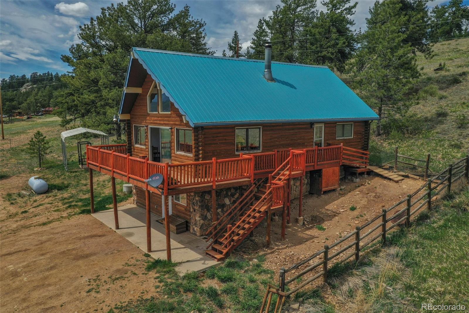 an aerial view of a house with roof deck front of house