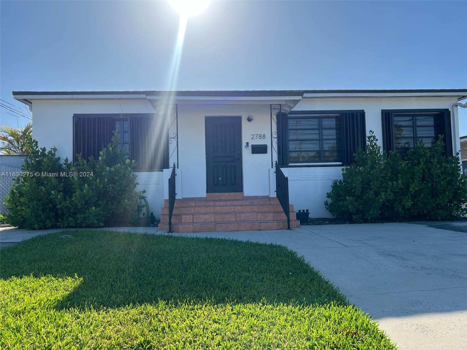 front view of a house with a yard