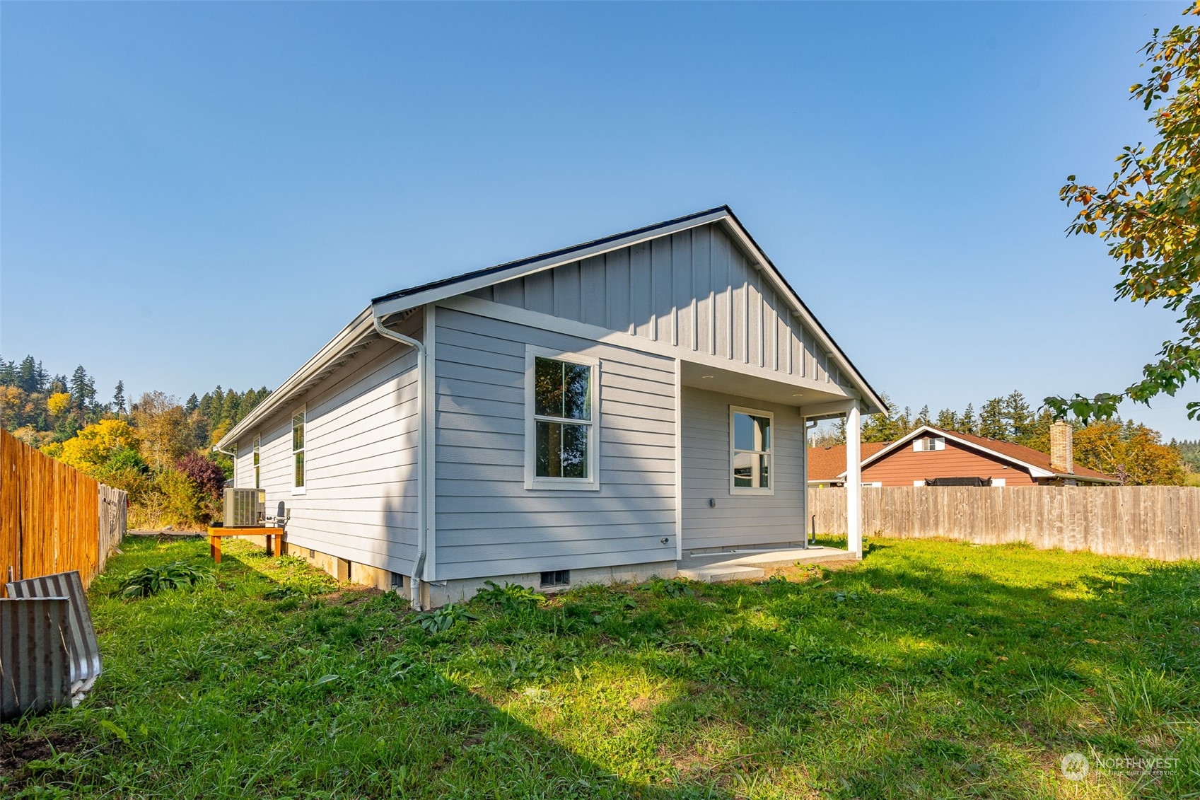 a view of a house with a yard and deck