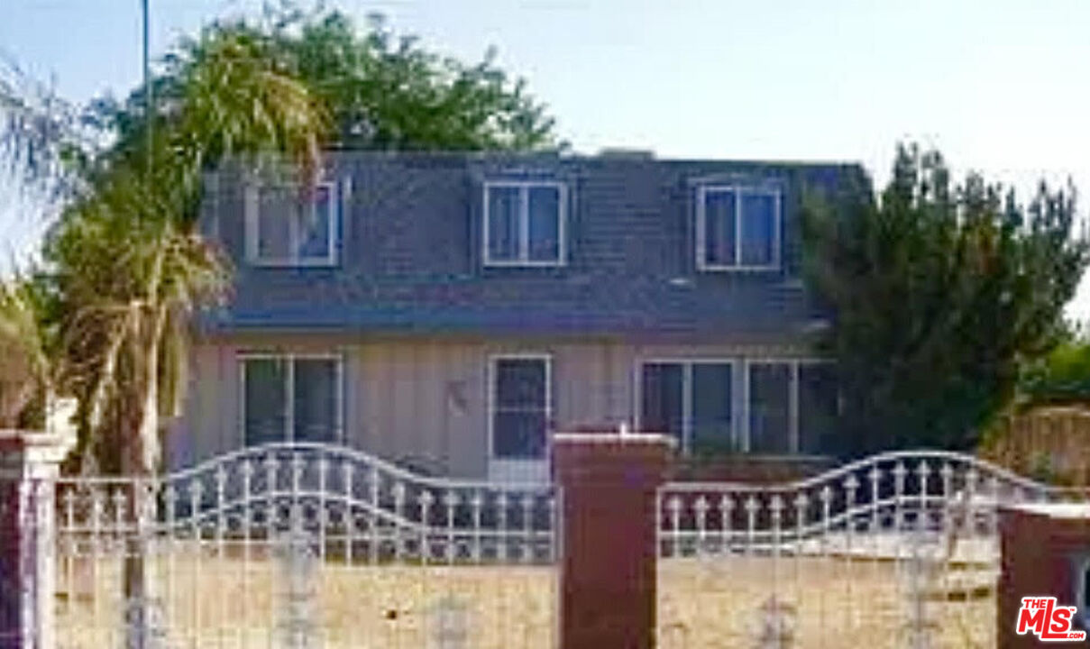 a front view of a house with yard