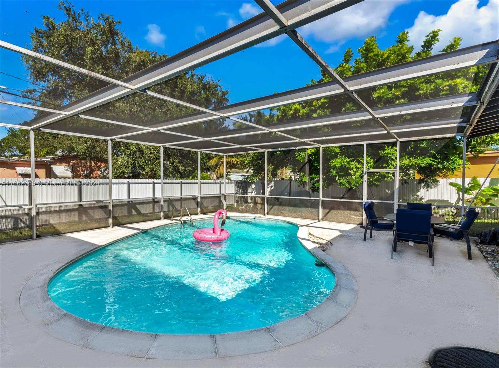 a view of a swimming pool with a patio