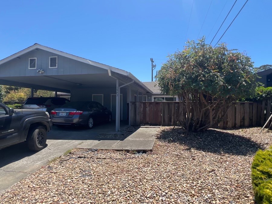 a view of a car parked in front of a house