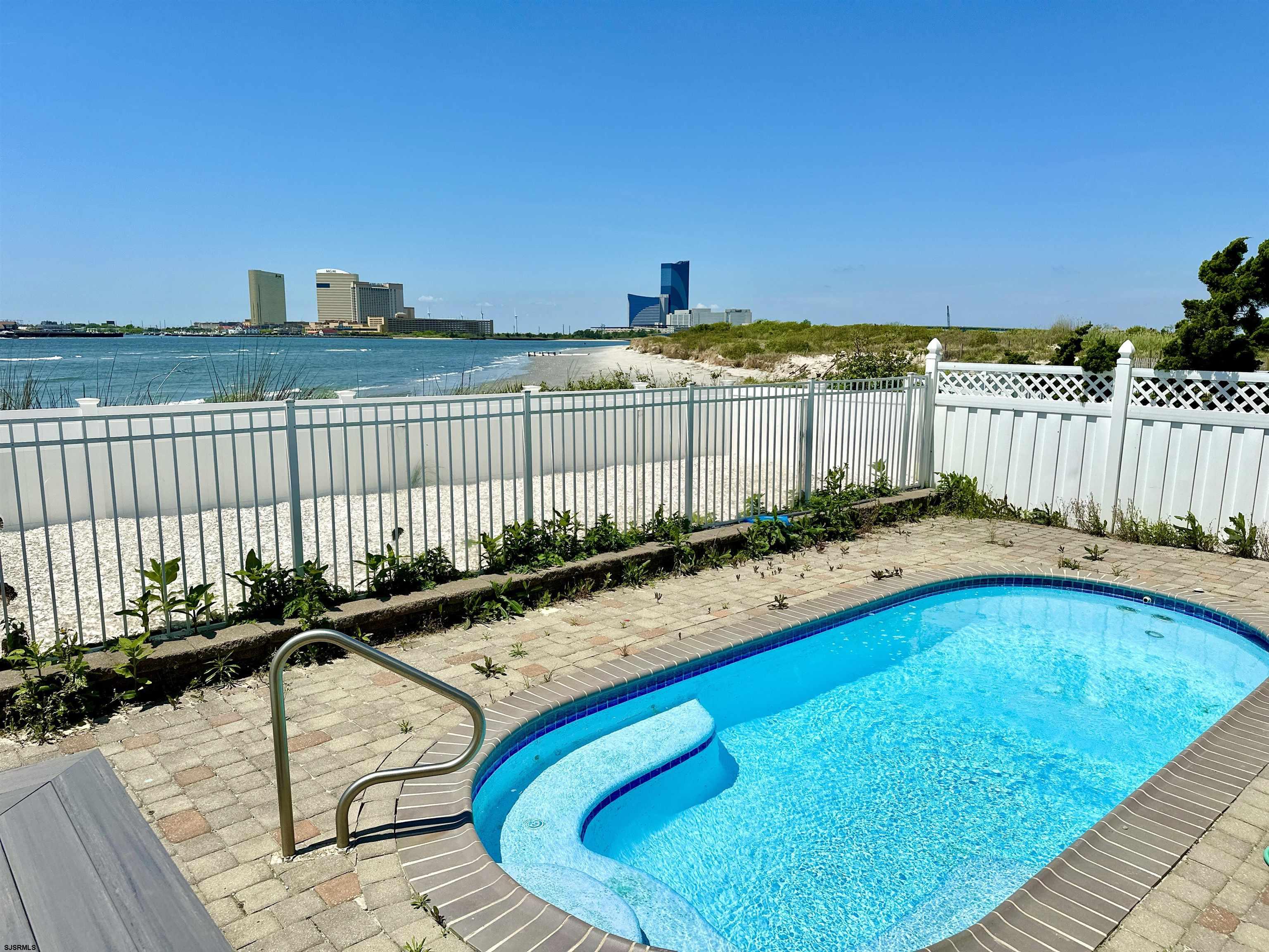 a view of swimming pool with seating space