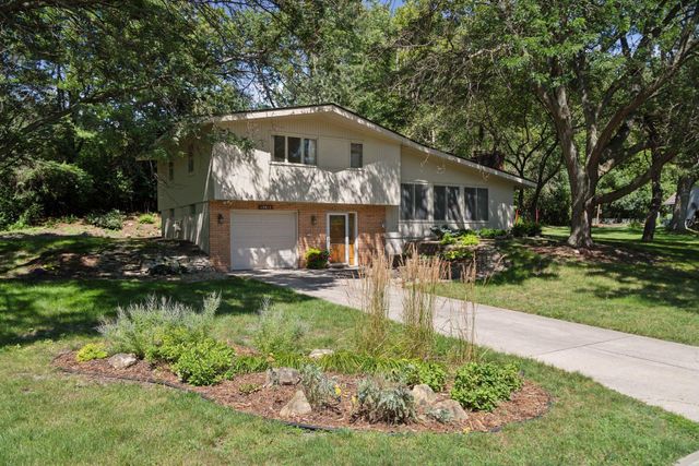 $415,000 | 15812 Woodgate Road North | Woodland-Highland