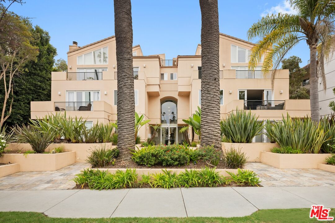 a front view of a residential houses with yard