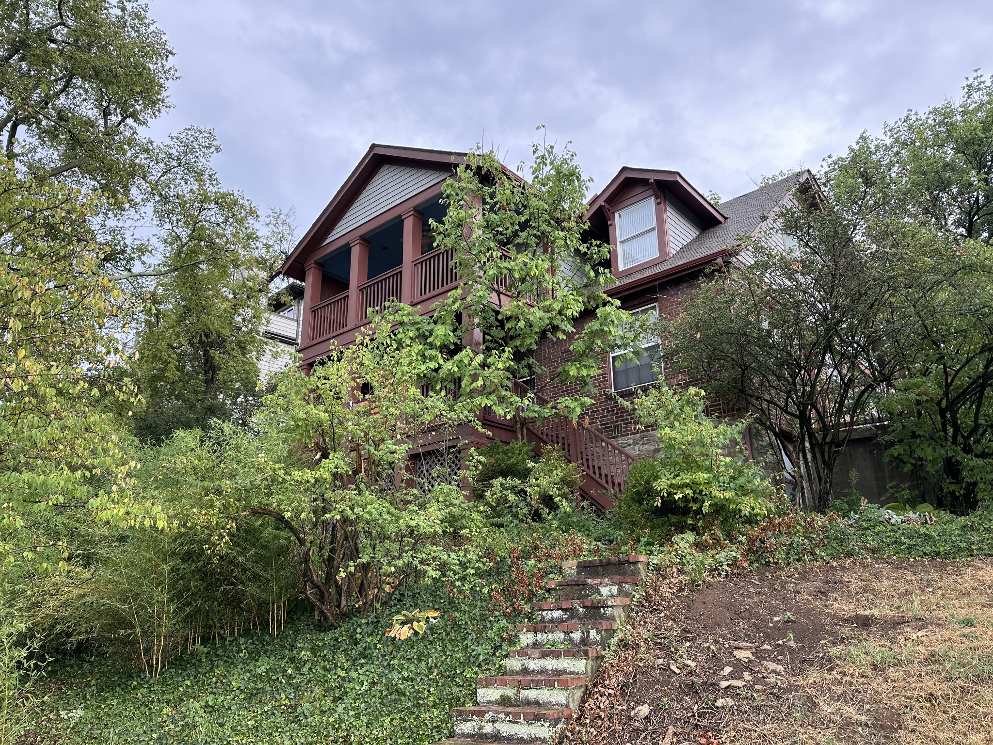 a view of a house with a yard and plants