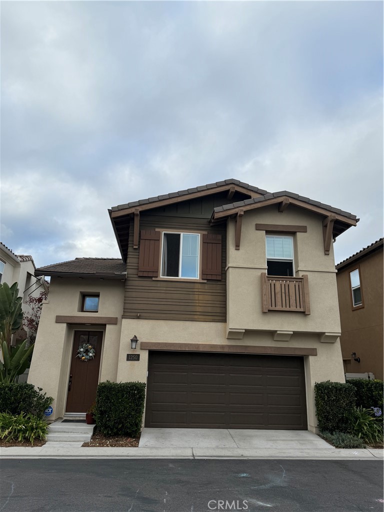 a front view of a house with garage