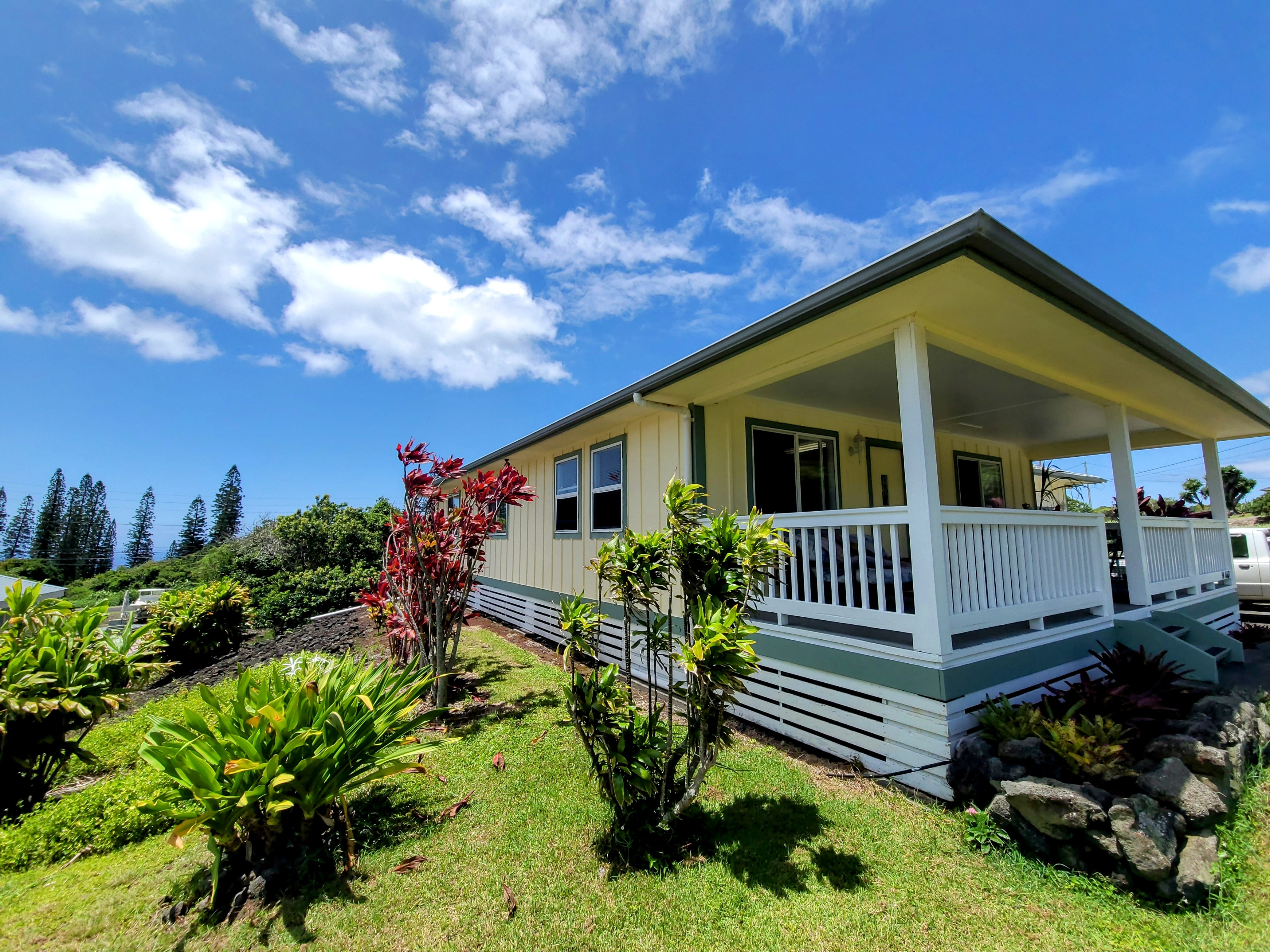 a front view of a house with a yard