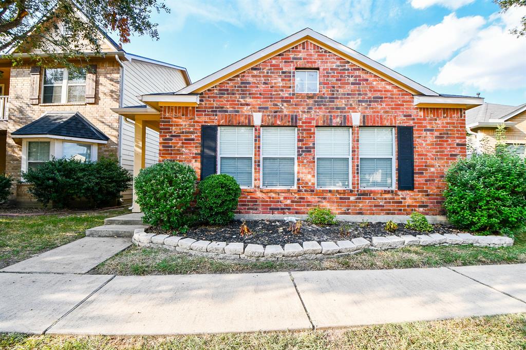 Welcome Home! A charming one-story brick home with clean, well-kept landscaping.