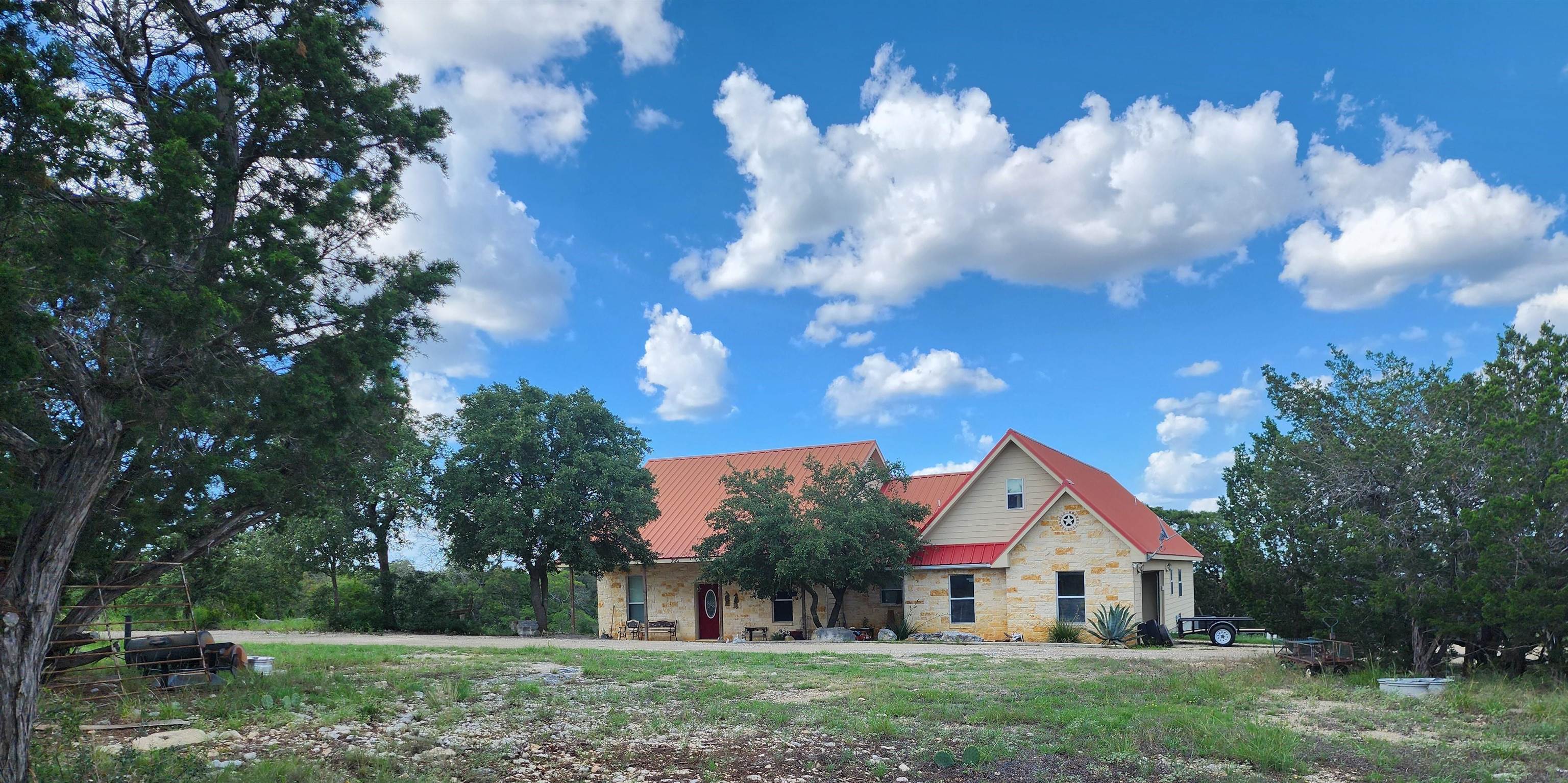 a view of house with backyard