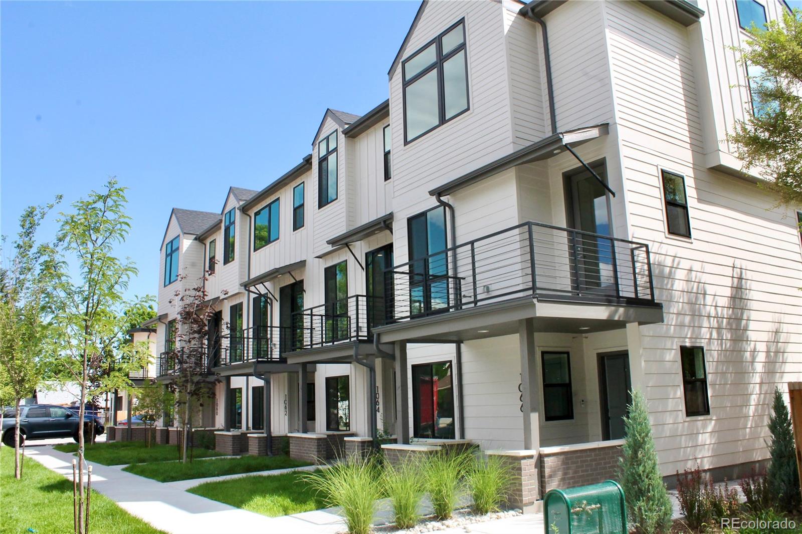 a view of a building next to a yard