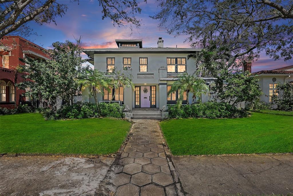 a front view of a house with garden