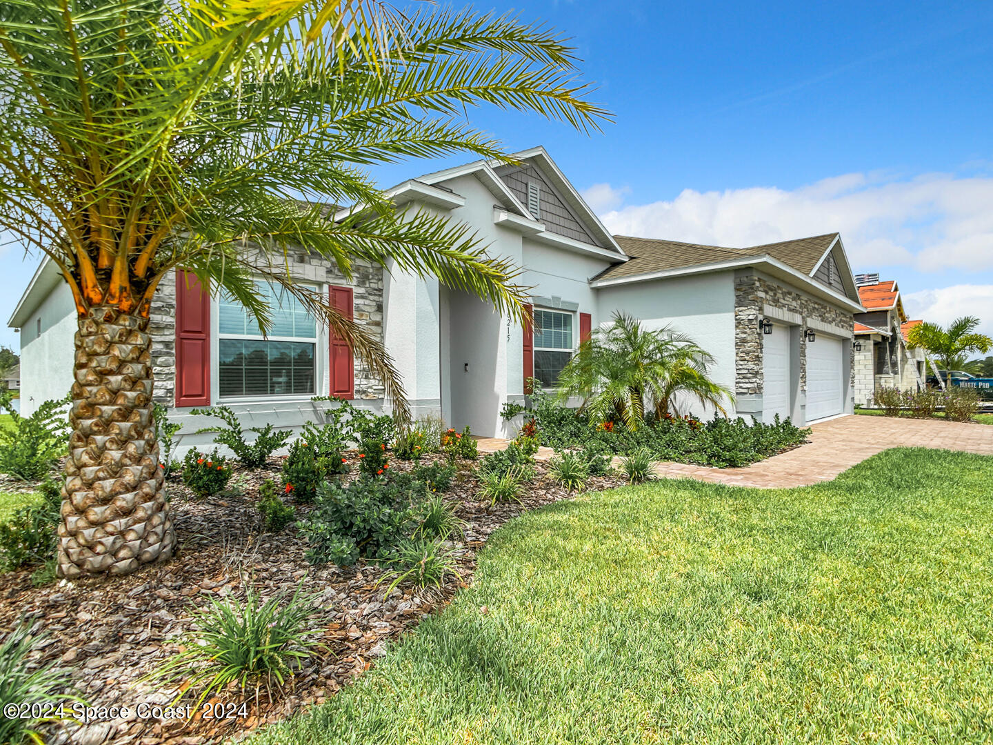 front view of a house with a yard