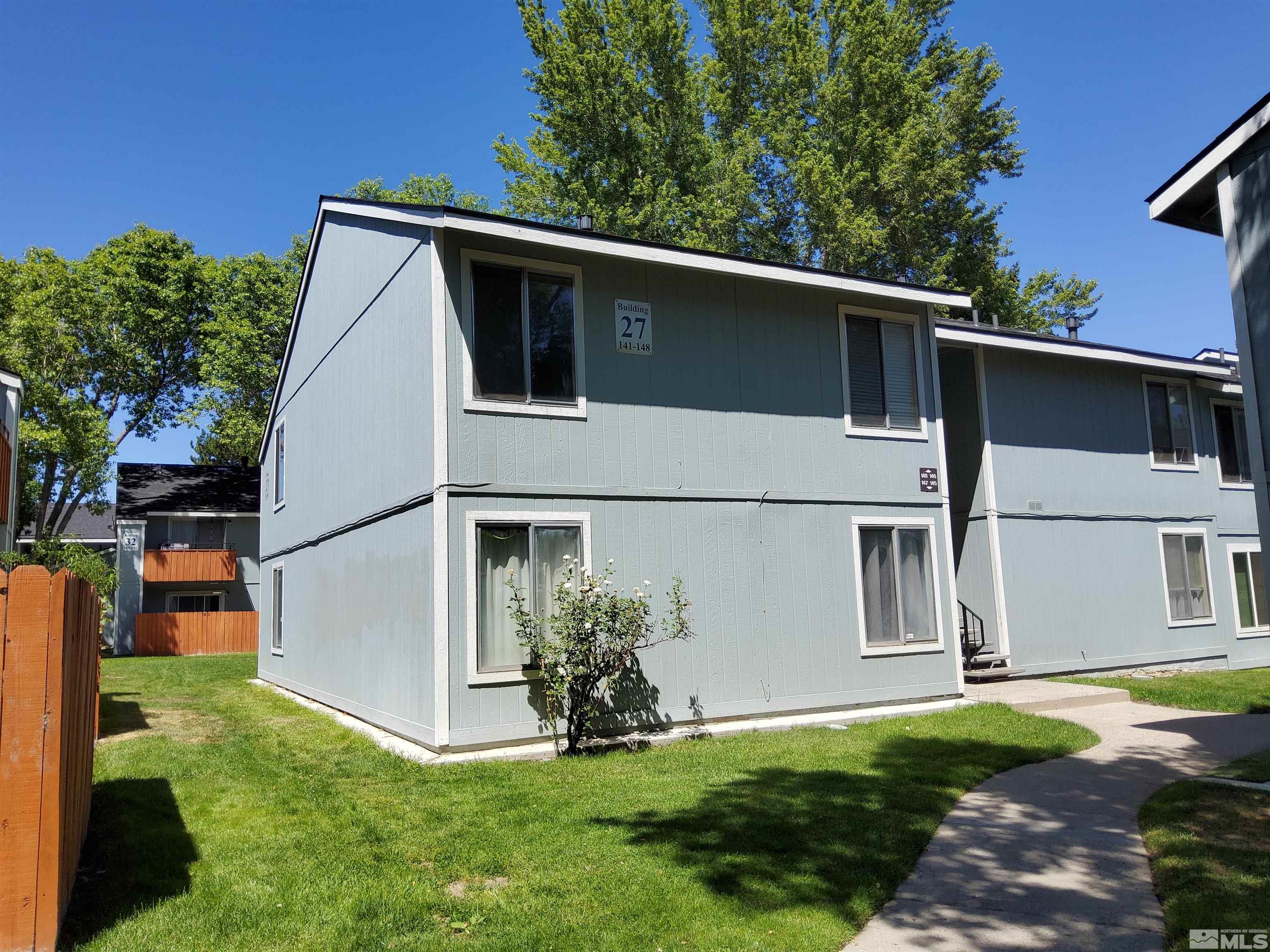 a view of a backyard of the house