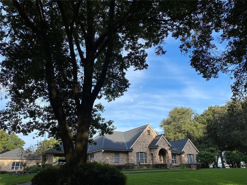 a view of house with yard