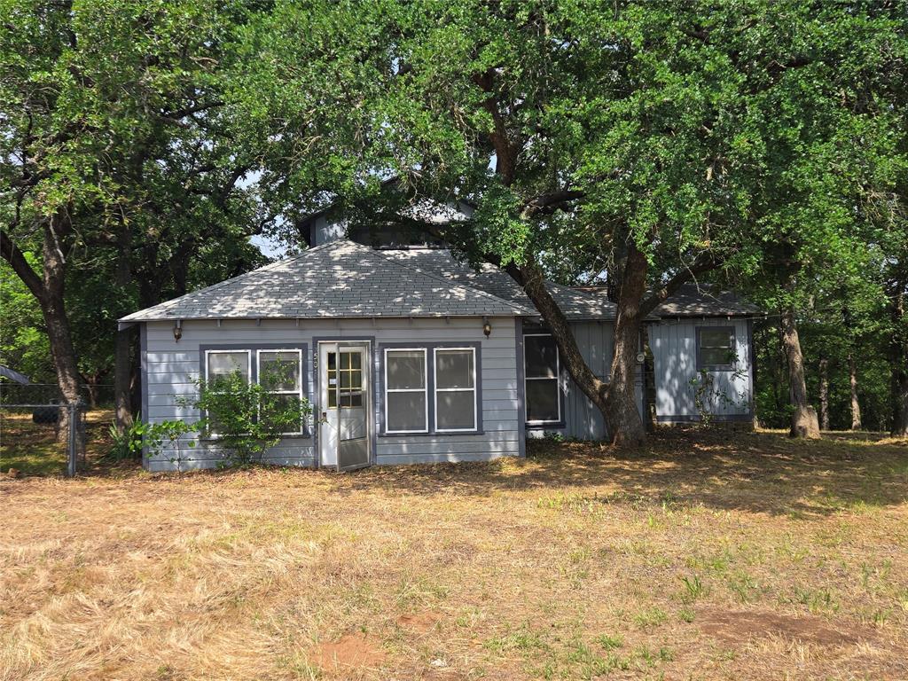 a house with a tree in front of it