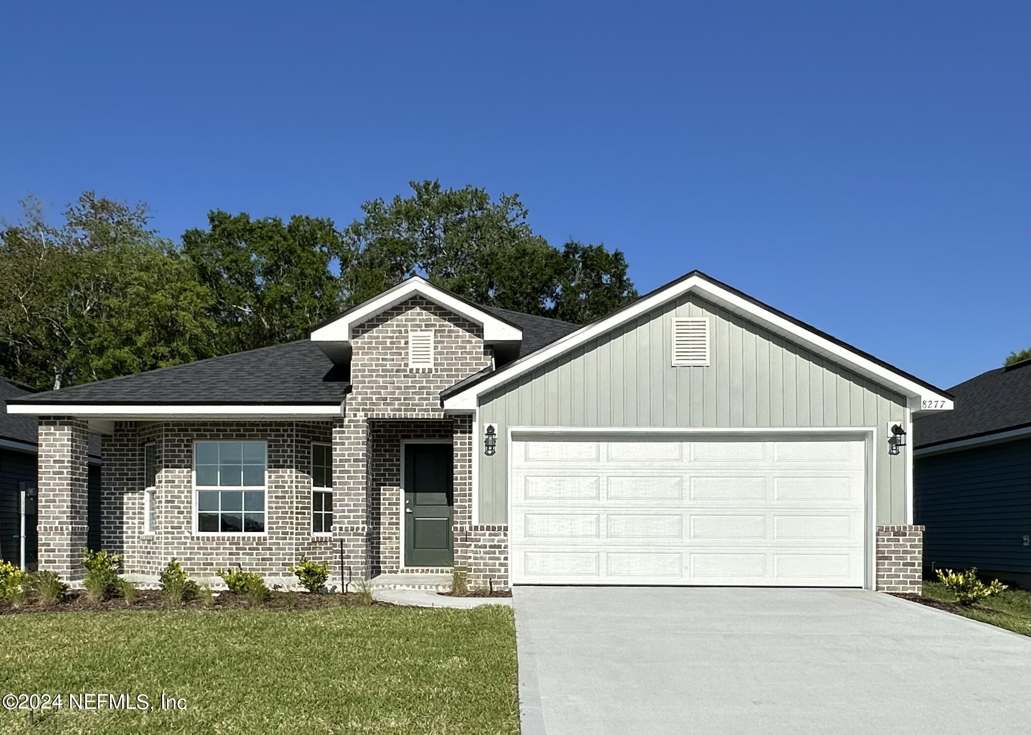 front view of a house with a yard