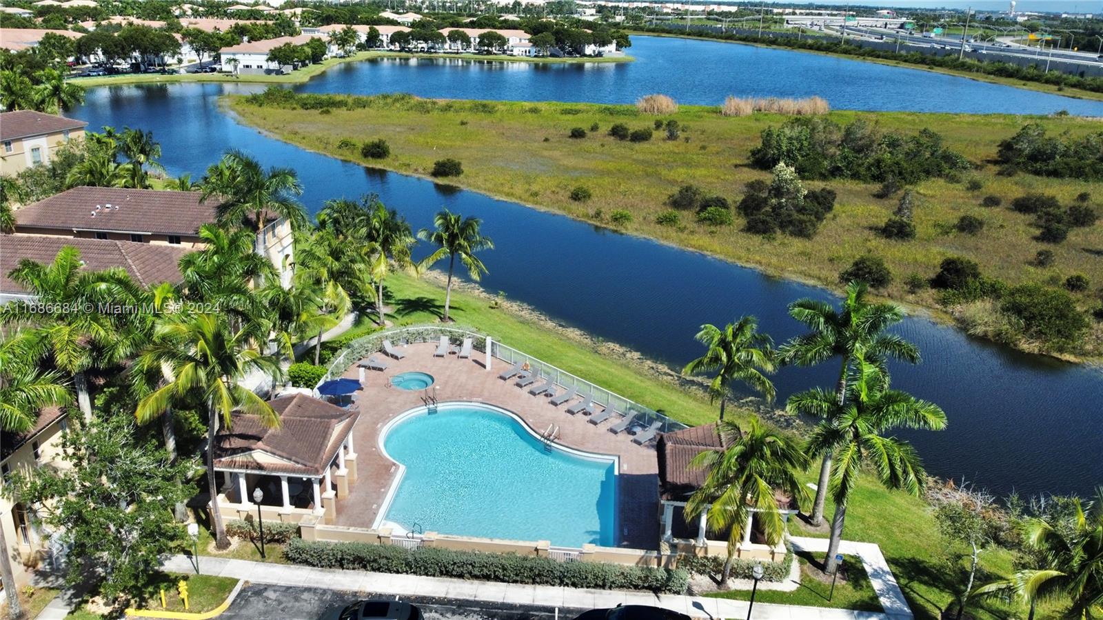 an aerial view of a house with a lake view