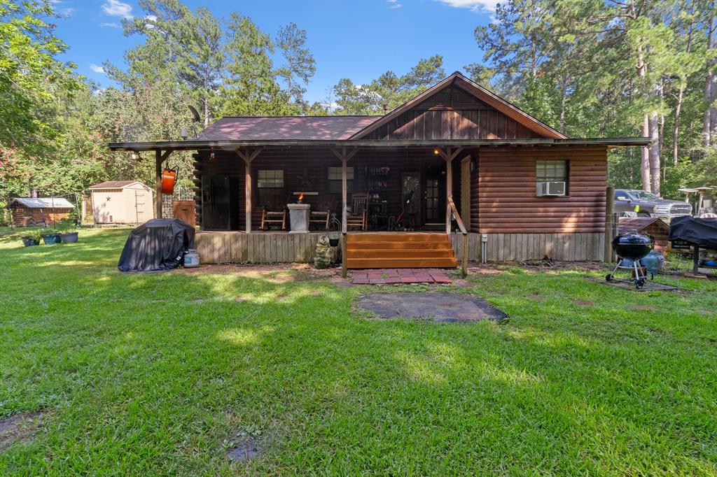 a front view of a house with a yard table and chairs