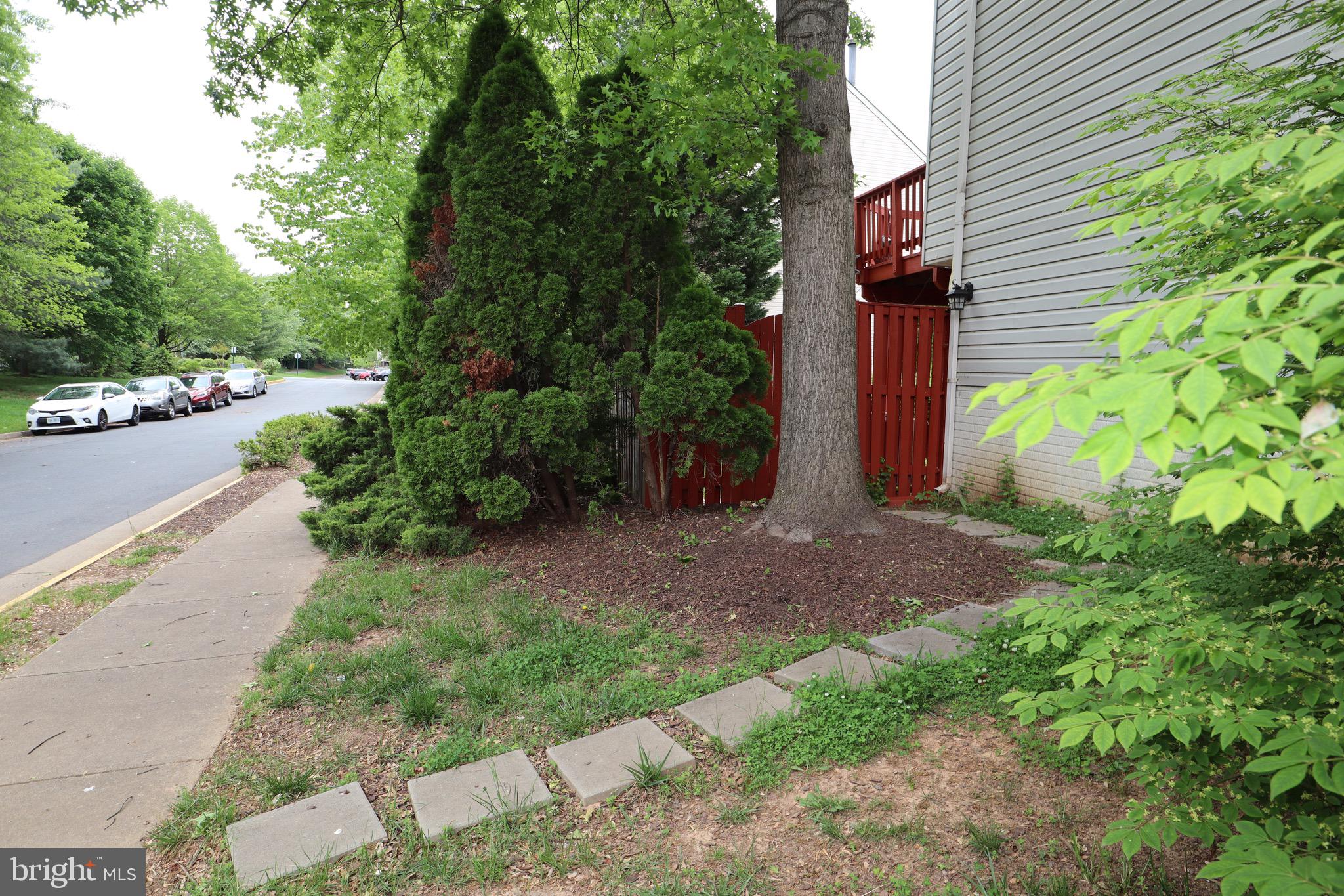 a view of a house with a yard and garage