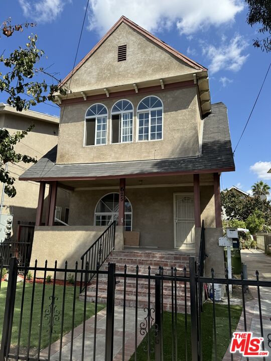 a front view of a house with a porch