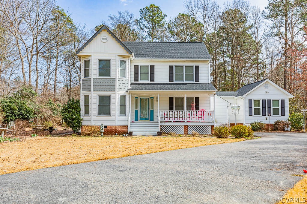 View of front of house with covered porch