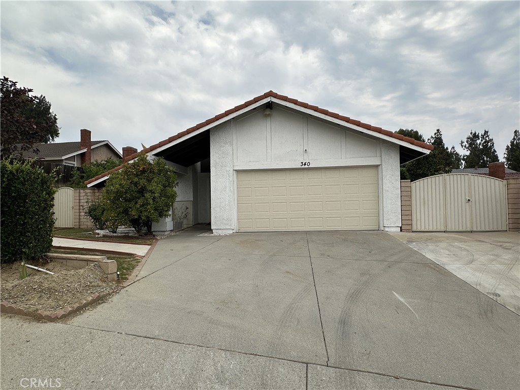 a view of garage yard and garage