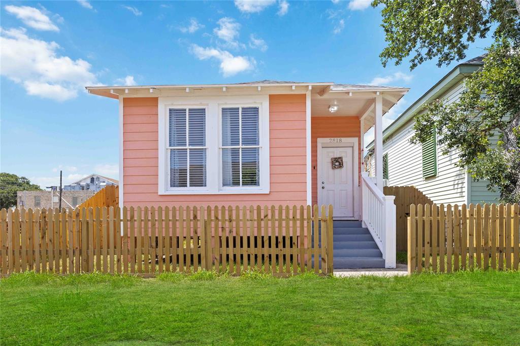 a view of front door of house with a yard