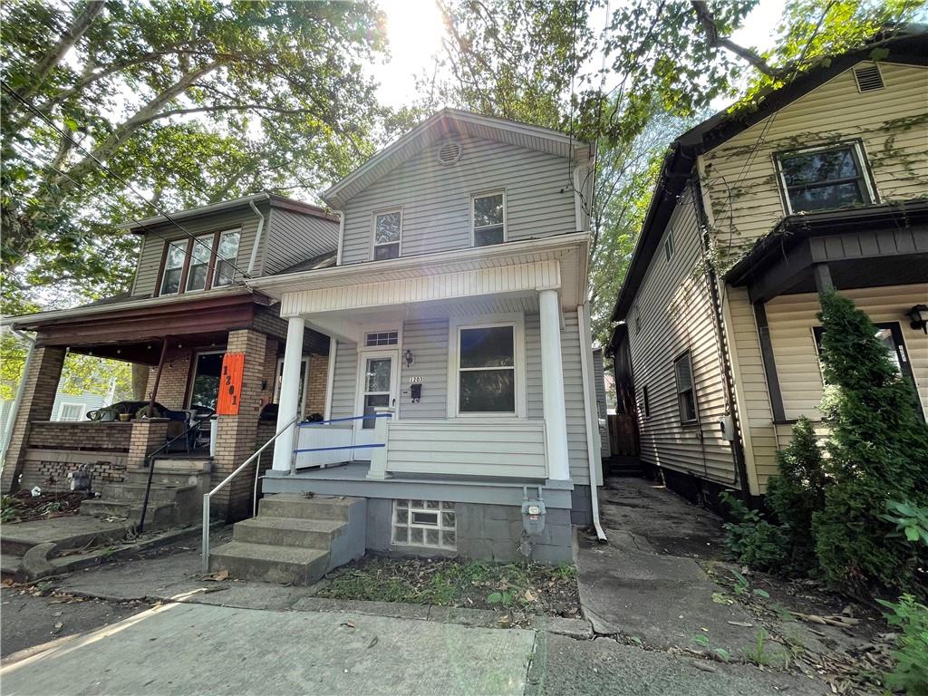 a front view of a house with garage