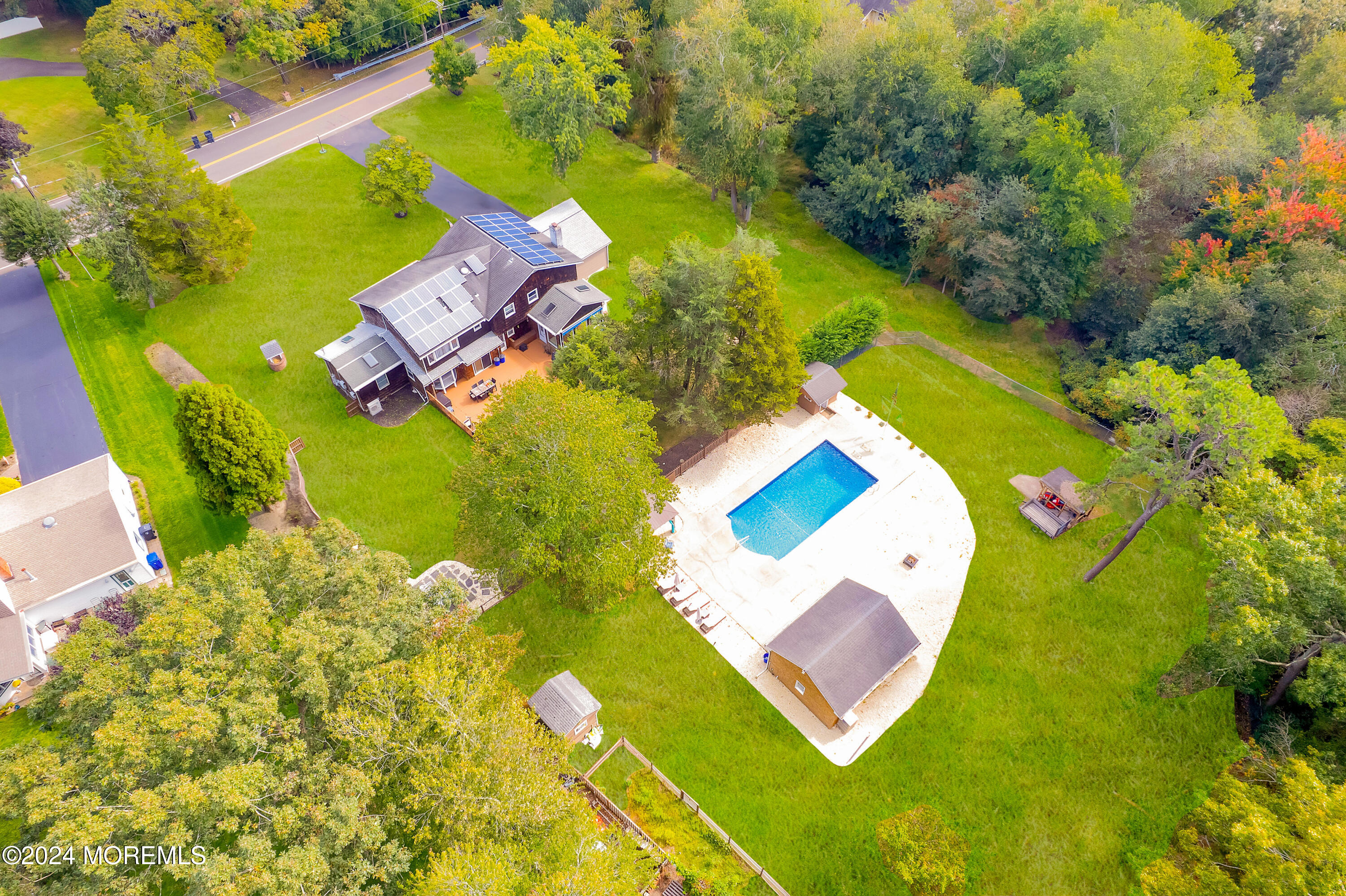 an aerial view of a house with a swimming pool