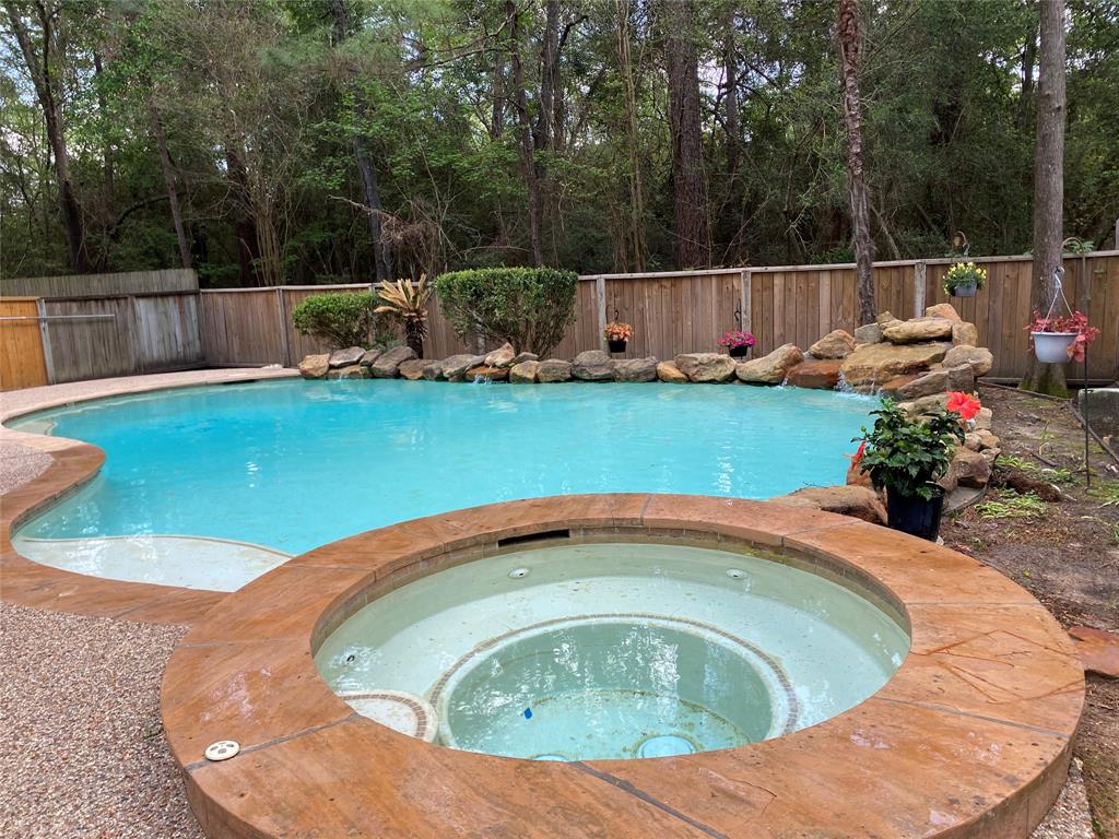 The backyard retreat is unmatched, featuring a sparkling pool and spa that back up to a serene greenbelt, offering ultimate privacy and tranquility. For the Gardner you will love the planting area.