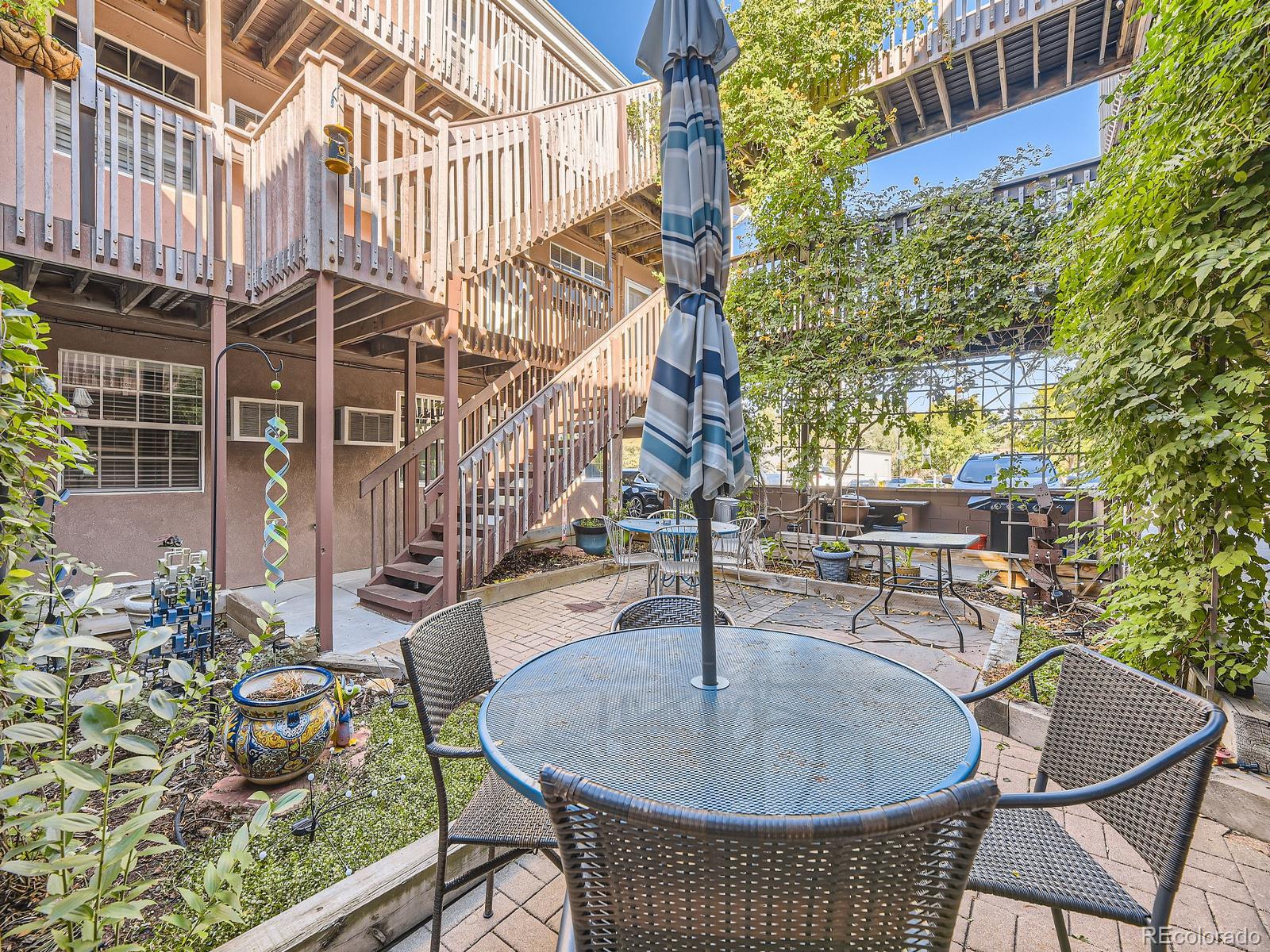 a backyard of a house with outdoor seating