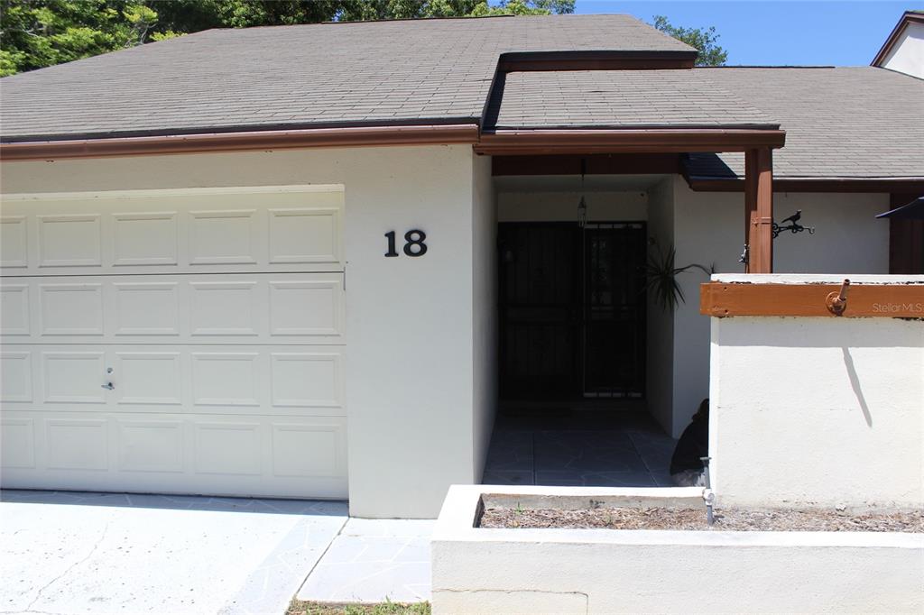 a view of entrance gate of a house