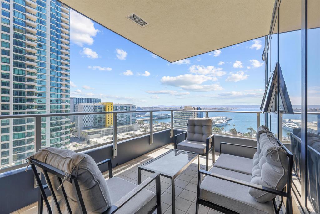 a view of a balcony with a table and chairs