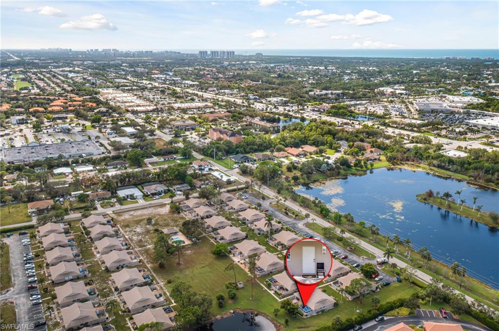 an aerial view of residential houses with city view