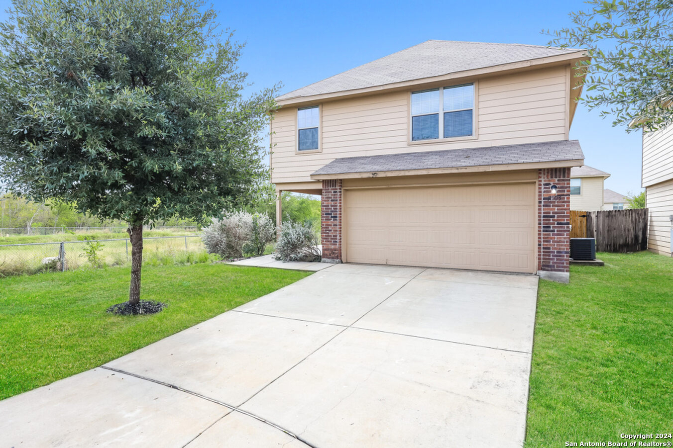 a front view of house with a yard