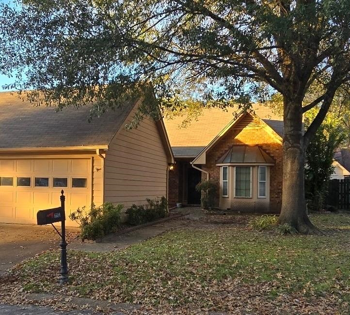 View of front of property featuring a garage