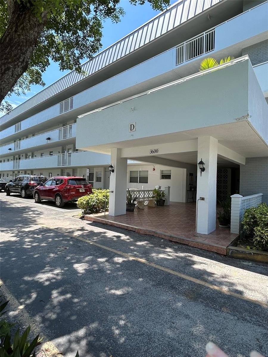 a view of a car park in front of a building